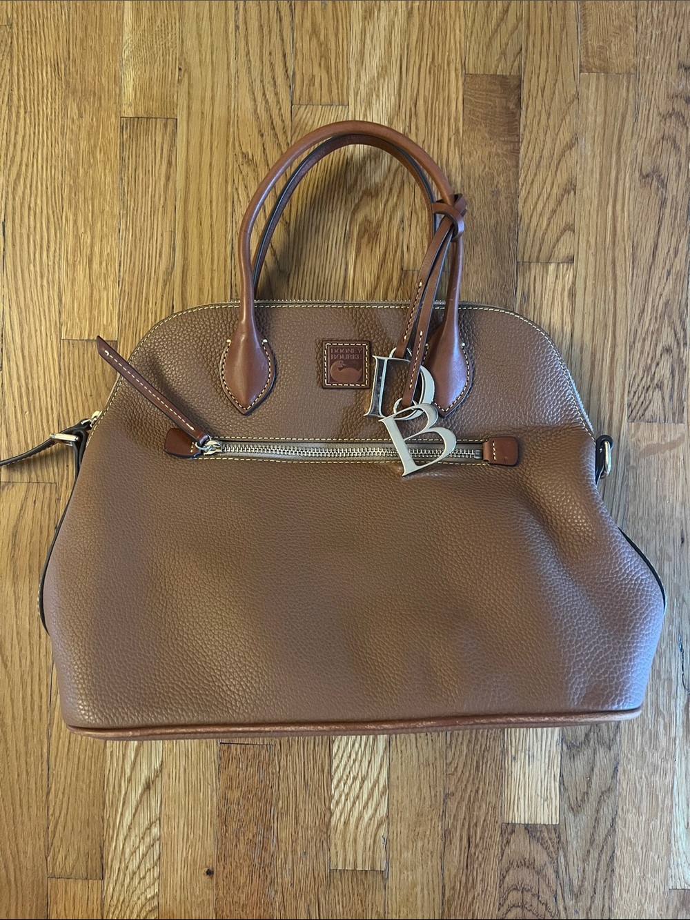 Dooney & Bourke Pebble Leather Satchel in Cognac Brown with Silver Charm